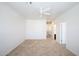 Expansive bedroom with neutral carpet, a ceiling fan, and access to a hallway and bathroom, offering comfort and convenience at 3113 E Danbury Rd # 10, Phoenix, AZ 85032