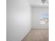Bright bedroom featuring neutral carpet, ceiling fan and natural light from the window at 3113 E Danbury Rd # 10, Phoenix, AZ 85032