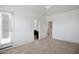 Spacious bedroom with neutral carpeting, a ceiling fan, and access to a balcony, perfect for relaxation and enjoying outdoor views at 3113 E Danbury Rd # 10, Phoenix, AZ 85032