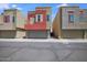 Exterior view of townhomes with attached garages and low maintenance desert landscaping at 3113 E Danbury Rd # 10, Phoenix, AZ 85032