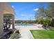 Community pool and lounging area with manicured landscaping and shaded seating at 3113 E Danbury Rd # 10, Phoenix, AZ 85032