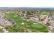 Scenic aerial view of a golf course and homes within a meticulously planned community at 3467 N Hooper St, Buckeye, AZ 85396