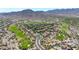 Expansive aerial view of a community near a golf course at 3467 N Hooper St, Buckeye, AZ 85396
