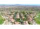 Birds-eye view of a residential area featuring uniform architecture and verdant landscaping at 3467 N Hooper St, Buckeye, AZ 85396