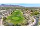 Aerial view of a golf course and surrounding houses at 3467 N Hooper St, Buckeye, AZ 85396