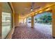 Expansive covered patio featuring brick pavers, ceiling fans and recessed lighting at 3467 N Hooper St, Buckeye, AZ 85396