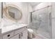 Modern bathroom with a glass bowl sink, white quartz counters, and a stunning glass-enclosed shower at 3467 N Hooper St, Buckeye, AZ 85396