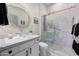 Modern bathroom with glass bowl sink, quartz counters, decorative mirror, and glass shower door at 3467 N Hooper St, Buckeye, AZ 85396