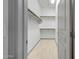 Walk-in closet with built-in shelving and ample storage space at 3467 N Hooper St, Buckeye, AZ 85396