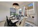 Elegant dining room with contemporary table and chairs, and a view to the patio at 3467 N Hooper St, Buckeye, AZ 85396