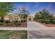 Inviting home with a well-kept front yard, mature trees, and a neatly paved driveway enhancing its curb appeal and charm at 3467 N Hooper St, Buckeye, AZ 85396
