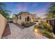 Charming home exterior with a well-maintained paver walkway and inviting landscaping at 3467 N Hooper St, Buckeye, AZ 85396