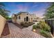Beautiful exterior with paver walkway and lush desert landscaping creating curb appeal at 3467 N Hooper St, Buckeye, AZ 85396
