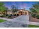 Attractive home exterior with a paved driveway, lush landscaping, and warm exterior lighting at 3467 N Hooper St, Buckeye, AZ 85396