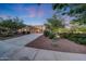 Spacious home exterior with a long driveway and well-manicured desert landscaping at 3467 N Hooper St, Buckeye, AZ 85396