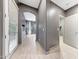 Stylish hallway offers a glimpse into the living area with neutral paint and modern flooring at 3467 N Hooper St, Buckeye, AZ 85396