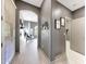 Hallway view with art on walls and views into adjacent rooms at 3467 N Hooper St, Buckeye, AZ 85396