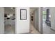Hallway showcasing entrances to a bedroom and bathroom, all with tile flooring at 3467 N Hooper St, Buckeye, AZ 85396