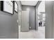 Hallway view with art on walls and views into adjacent rooms at 3467 N Hooper St, Buckeye, AZ 85396