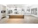 Bright kitchen boasts a large island, stainless steel appliances, and subway tile backsplash at 3467 N Hooper St, Buckeye, AZ 85396