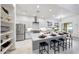 Gourmet kitchen with stainless steel appliances, island, and stylish modern finishes at 3467 N Hooper St, Buckeye, AZ 85396