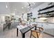 Modern kitchen with stainless steel appliances and an island, adjoining dining area at 3467 N Hooper St, Buckeye, AZ 85396