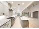 Spacious kitchen features stainless steel appliances, a large island, and subway tile backsplash at 3467 N Hooper St, Buckeye, AZ 85396