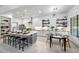 Kitchen with a center island, modern lighting, and a view to the dining area at 3467 N Hooper St, Buckeye, AZ 85396