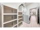Spacious laundry area boasts modern units, ample storage, and stylish organizers in a well-lit space at 3467 N Hooper St, Buckeye, AZ 85396