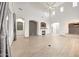 Spacious living room with a fireplace, fan, and tile floors at 3467 N Hooper St, Buckeye, AZ 85396