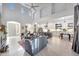 Bright open-concept living room with a gourmet kitchen and high ceilings at 3467 N Hooper St, Buckeye, AZ 85396