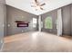 Spacious living room featuring a modern fireplace, neutral walls, and lots of natural light at 3467 N Hooper St, Buckeye, AZ 85396