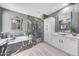 This main bathroom boasts marble accents, modern lighting, dual vanities, and a luxurious bathtub and shower at 3467 N Hooper St, Buckeye, AZ 85396