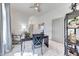 Bright home office featuring a large window, neutral color palette, ceiling fan, and stylish decor at 3467 N Hooper St, Buckeye, AZ 85396