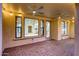 View of the covered patio featuring brick pavers, lighting, and access to the interior of the home at 3467 N Hooper St, Buckeye, AZ 85396