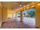 Spacious covered patio with brick flooring, ceiling fans, and ample lighting perfect for outdoor relaxation and entertaining at 3467 N Hooper St, Buckeye, AZ 85396