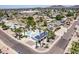 Aerial view of the home in a quiet neighborhood featuring a private pool and solar panels at 3646 W Brown St, Phoenix, AZ 85051