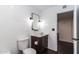 Bright bathroom with modern fixtures, subway tile, and a dark wood cabinet underneath the sink at 3646 W Brown St, Phoenix, AZ 85051