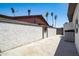 Exterior view featuring a stucco wall with a wood fence and greenery at 3646 W Brown St, Phoenix, AZ 85051