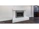 Close up of a fireplace with decorative grate and dark wood floors at 3646 W Brown St, Phoenix, AZ 85051