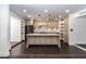 Elegant kitchen features a large island, modern appliances, and beautiful custom cabinetry at 3646 W Brown St, Phoenix, AZ 85051