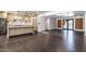 Open-concept kitchen and living space with dark wood floors and modern cabinetry at 3646 W Brown St, Phoenix, AZ 85051