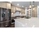Beautiful kitchen with stainless steel appliances, a large island, and custom cabinetry details at 3646 W Brown St, Phoenix, AZ 85051