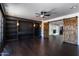 Spacious living room featuring a fireplace and custom built-in shelving at 3646 W Brown St, Phoenix, AZ 85051
