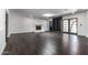 Spacious living room featuring a fireplace, dark floors and custom built-in shelving at 3646 W Brown St, Phoenix, AZ 85051