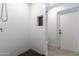 This bathroom features an updated shower with white tile, a built-in niche, and updated hardware at 3646 W Brown St, Phoenix, AZ 85051