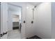 This bathroom features an updated shower with white tile and updated hardware; the walk-in closet is visible at 3646 W Brown St, Phoenix, AZ 85051