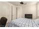 Relaxing bedroom with a comfortable bed, neutral walls, ceiling fan, and tv perfect for unwinding at 3783 E Stiles Ln, Gilbert, AZ 85295