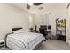 Comfortable bedroom with natural light, featuring a ceiling fan, and desk area for studying or work at 3783 E Stiles Ln, Gilbert, AZ 85295