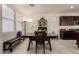 Bright dining area with a large table, stylish decor, and plenty of natural light through windows at 3783 E Stiles Ln, Gilbert, AZ 85295